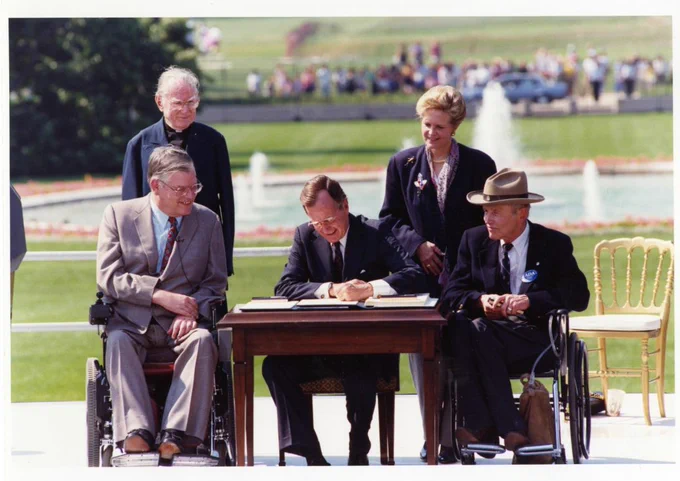 President George H. W. Bush signing the Americans with Disabilities Act.