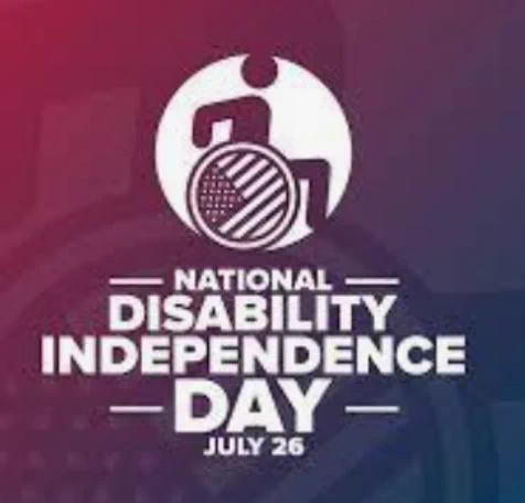 A red, white and blue graphic with a wheelchair symbol in the center and text that reads "National Disability Independence Day - July 26".