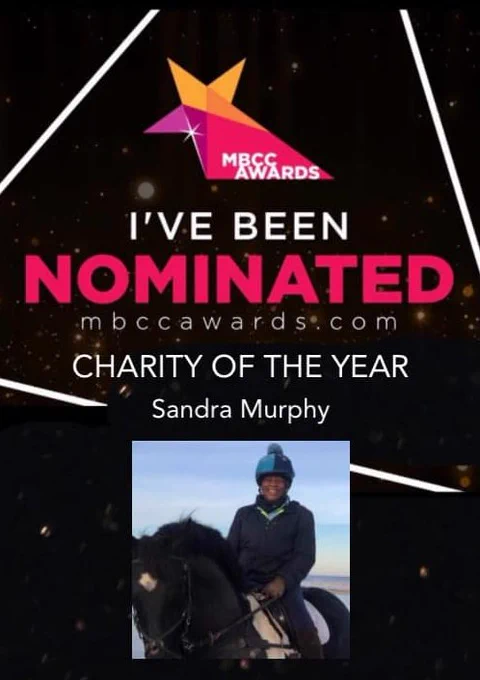 Nomination flyer with the words: "I've been nominated, Charity of the Year, Sandra Murphy" and the MBCC Awards website address: mbccawards.com. Image of Sandra Murphy on horseback wearing a two-tone, blue and black helmet and navy jacket.
