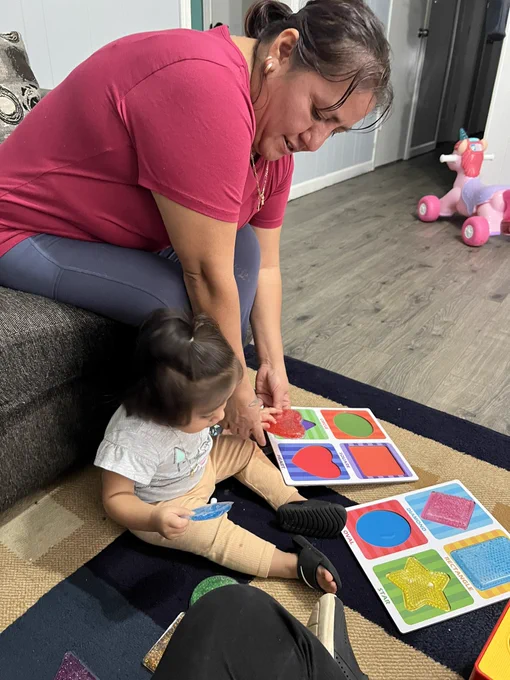 During a PAT visit with  Mrs. Gutierrez 
Mom is showing student J shapes and where to fit them into the shapes puzzle. #Sensory #family #familia #shaperecognition #dph #pat 
#finemotor 
#parentsasteachers