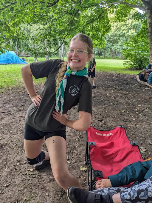 A Scout smiling and posing 