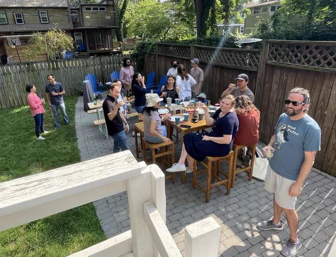 A group of people celebrating in a backyard
