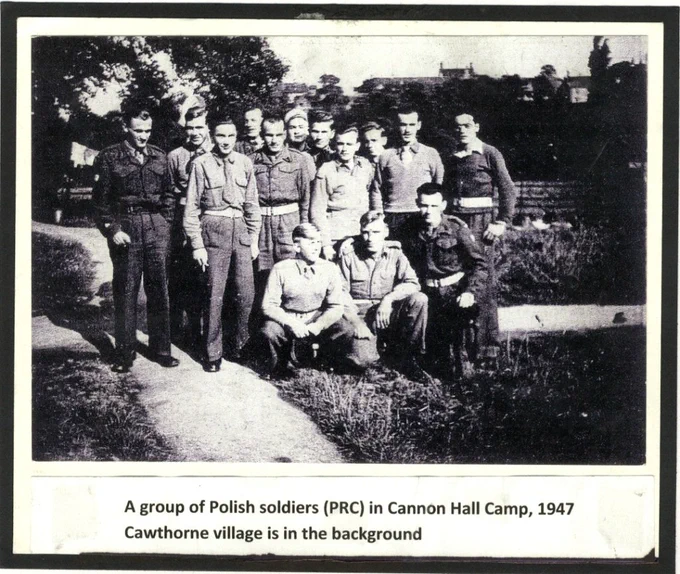 A black and white photo showing a group of Polish soldiers (PRC) in Cannon Hall Camp, 1947. They are standing and seated outdoors, with Cawthorne village visible in the background. A caption at the bottom provides details about the image.