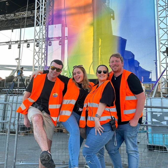 LCR Pride Foundation team in front of Pride in Liverpool Main Stage on Pier Head.