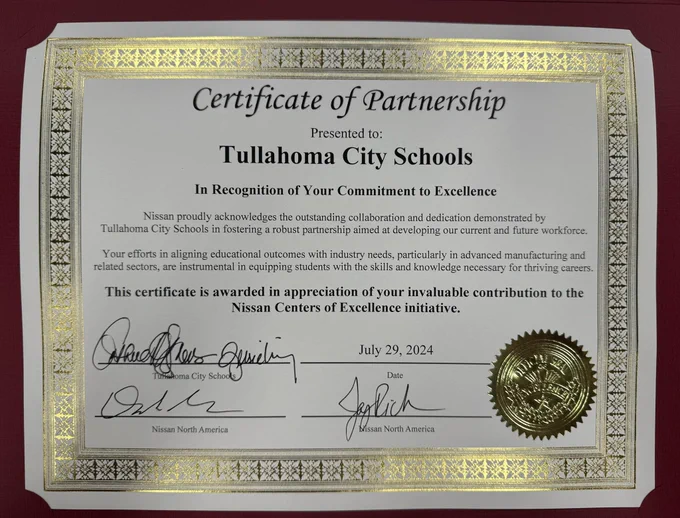 The signed Nissan and Tullahoma City Schools Center of Excellence Partnership certificate.