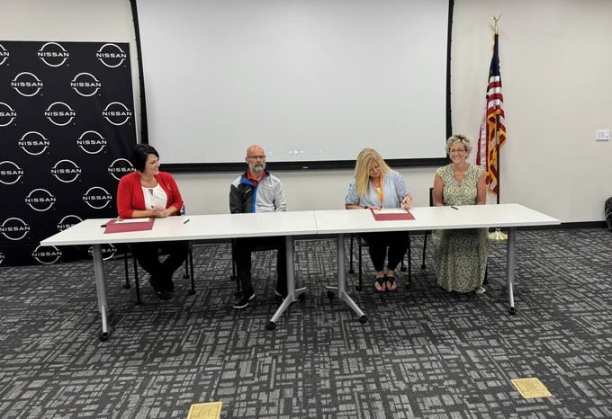 Superintendent, CTE Director, and two Nissan North America representatives signing the Center of Excellence Partnership certificate on signing day!