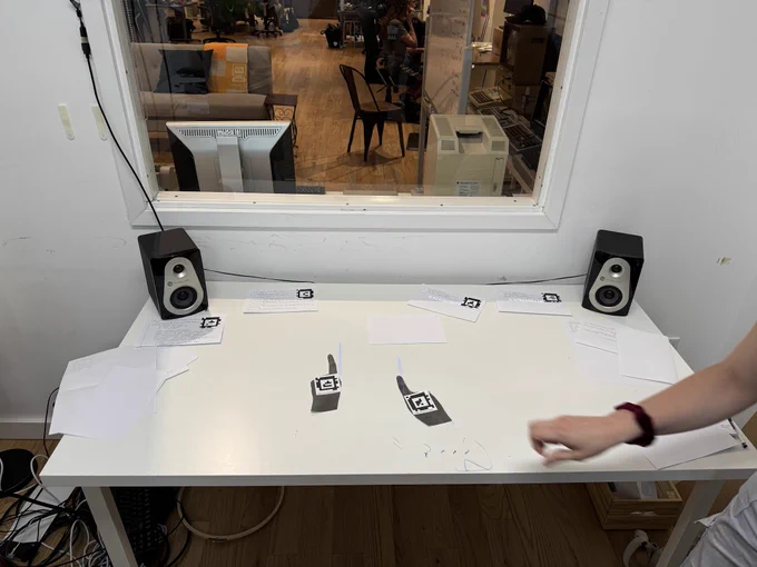A picture of two printed hands on the Recurse Folk system