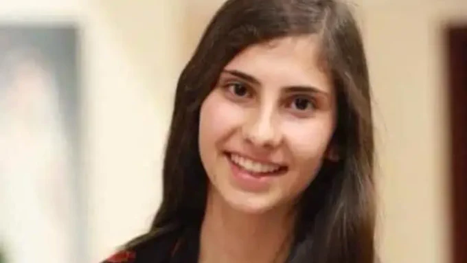 A picture of a young Layan Nasir. She has long dark hair and brown eyes. She is smiling and looking happy.