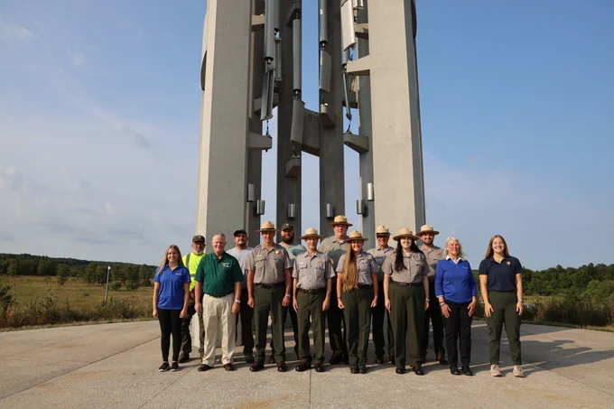 Image 2: Same group in front of the Tower of Voices. NPS Photo.