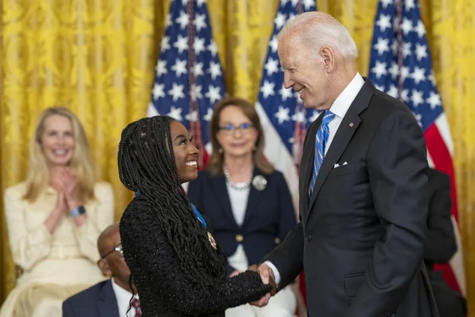 President Joe Biden presents the Medal of Freedom to gymnast Simon Biles, Thursday, July 7, 2022, in the East Room of the White House. 