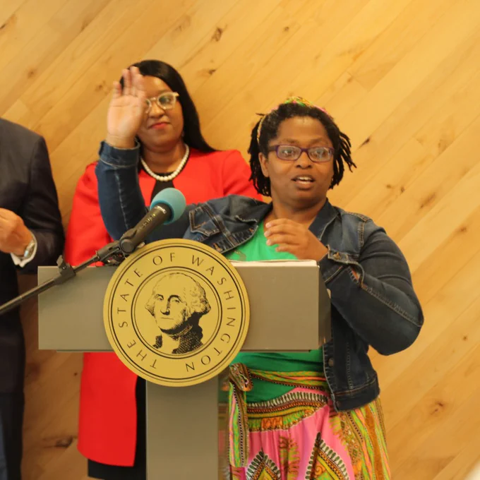 Moxie, a recipient of the grant, speaks at the event