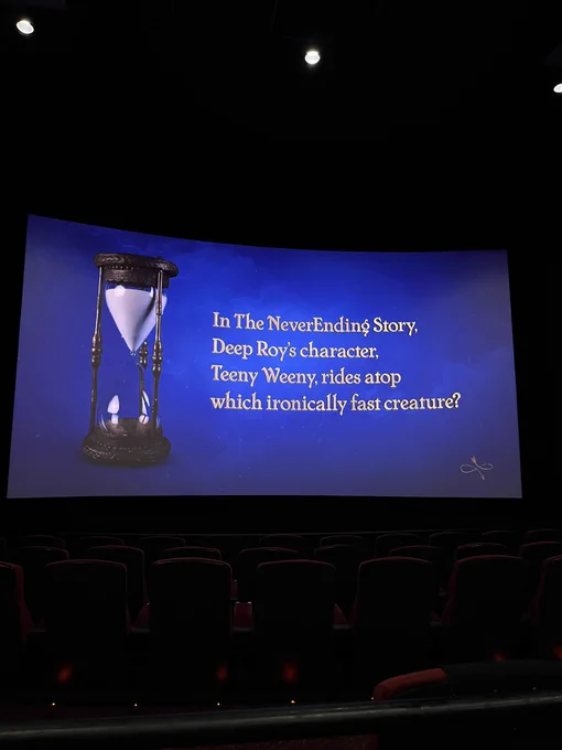 “In the Neverending Story, Deep Roy’s character Teeny Weeny rides atop which ironically fast creature?”
