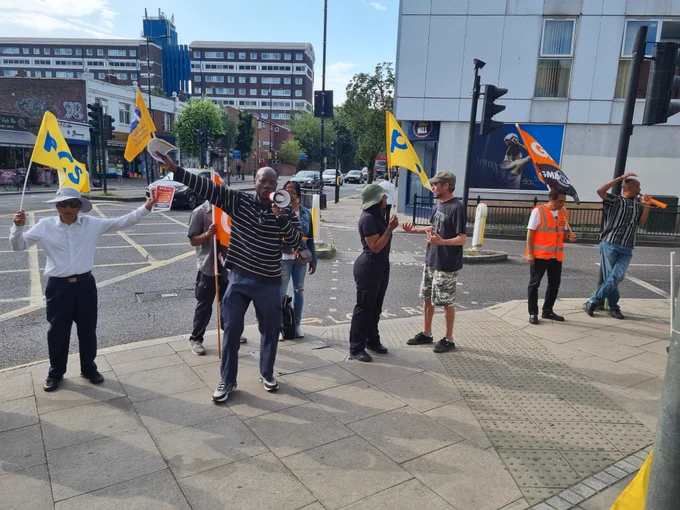 G4S strikers on the picket line with pcs flags 