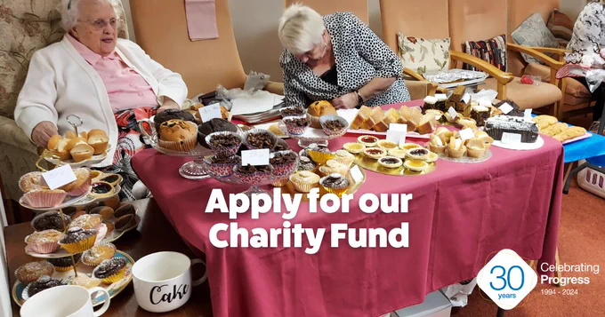 Image of tenants at Bolton Croft holding a cake sale for charity.
Text: Apply for our Charity Fund.
Include the 30 years celebrating Progress 1994- 2024 logo