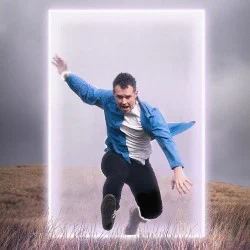A man leaps through a glowing portal