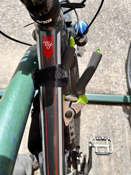 Secateurs secured to a bike frame