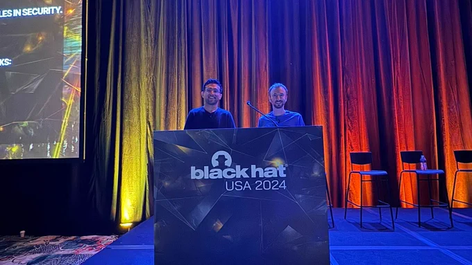 BlackHat USA 2024 Briefings Stage featuring Alex & Robert from NCC Group presenting on their research: Listen-Up: Sonos Over-The-Air Remote Kernel Exploitation and Covert Wiretap
