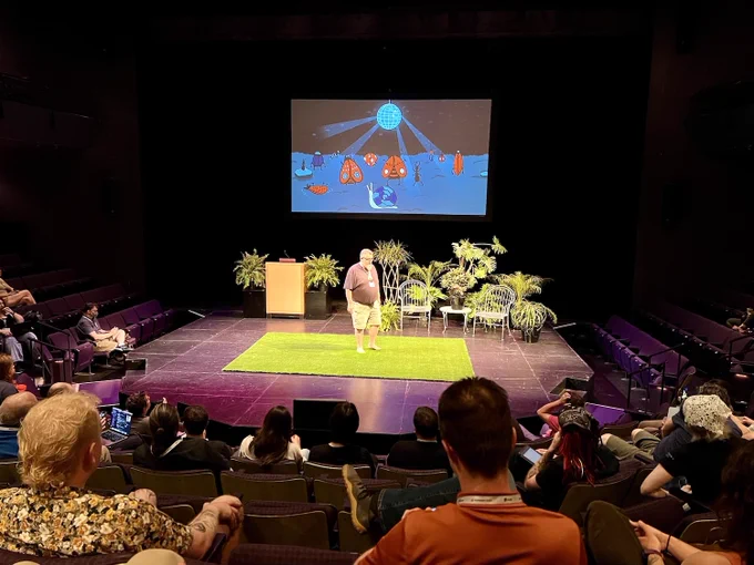 Picture of Jim Remsik on stage kicking off Madison  Ruby conference 2024