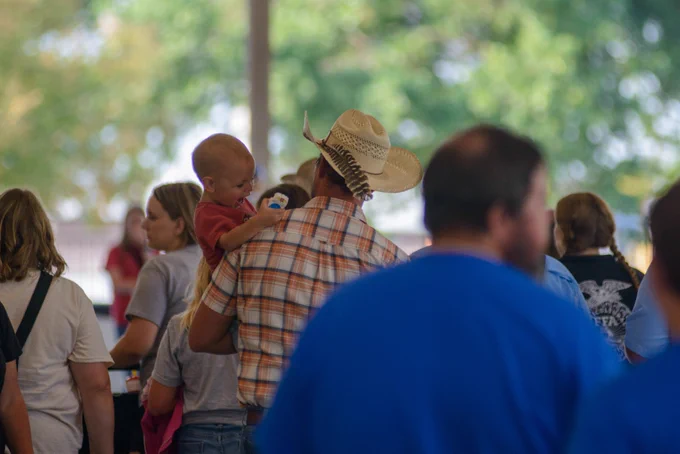 Farm Families enjoying dinner at Farm Family Day at the Missouri State Fair. 