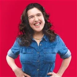 A smiling brunette woman on a red background