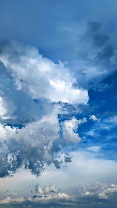 Before the storm: blue sky, white clouds.