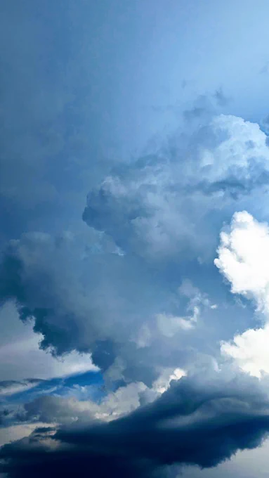Before the storm: blue sky, white clouds.