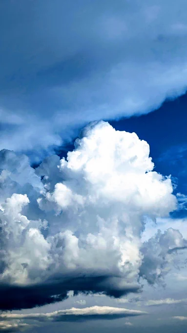 Before the storm: blue sky, white clouds.