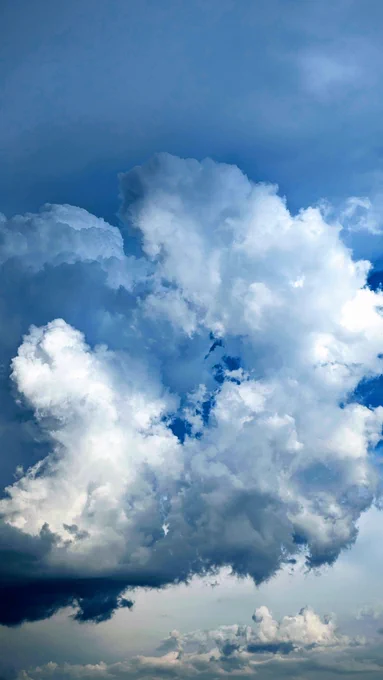 Before the storm: blue sky, white clouds.