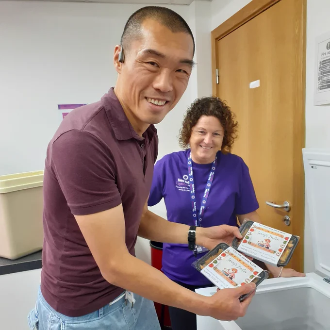 Dr Jibin He, Head of Department (Science) at Teesside University holding packets of Jenny's Pasta