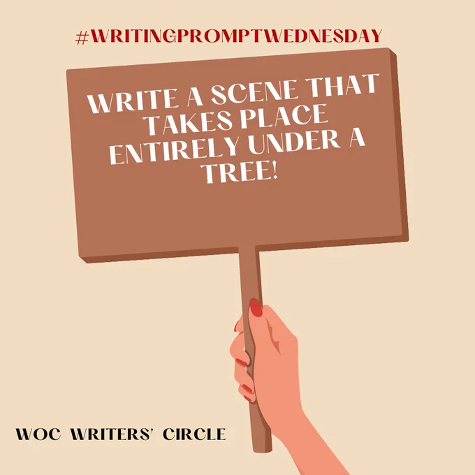 The image showcases a woman's hand holding up a sign. On the sign is the text "write a scene that takes place entirely under a tree." This is a post made by the WOC Writers' Circle.
