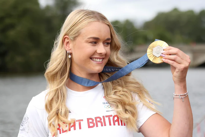 Hannah Scott pictured holding her Olympic Gold Medal at the homecoming reception in Bann Rowing Club.