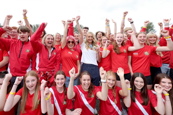 Hannah Scott with members of the Bann Rowing Club, pictured at the homecoming reception after her Olympic Gold Medal win.