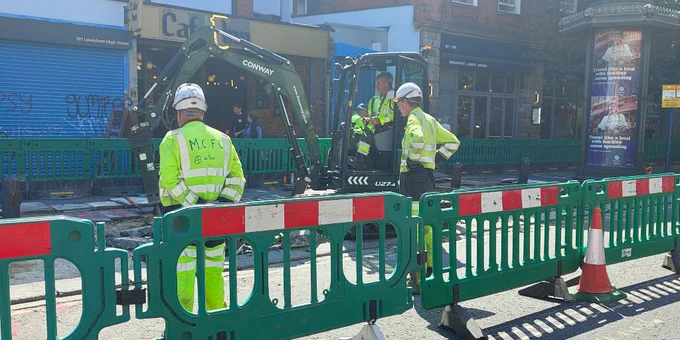 Construction machinery and workers on Lewisham High Street