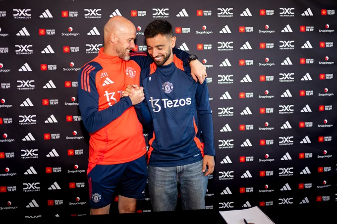 Erik ten Hag embraces Bruno Fernandes.