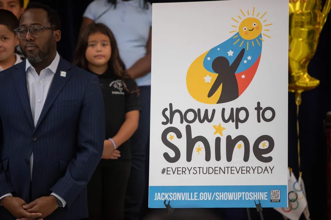a poster that says show up to shine
