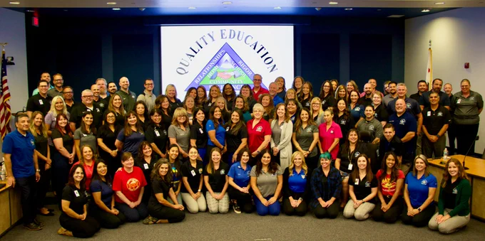 Group photo of the Beaumont Unified School District leadership team in the board room