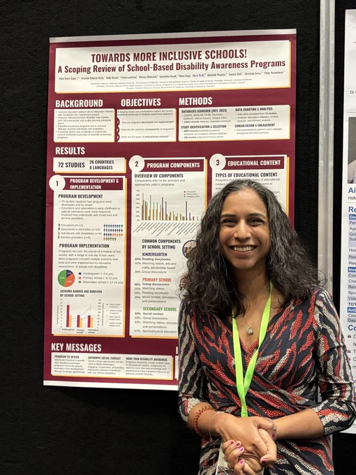 Michelle Phoenix in front of poster titled Towards More Inclusive Schools!
