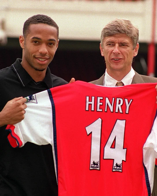 Thierry Henry and Arsène Wenger pose for a photograph upon revealing the new signing.
