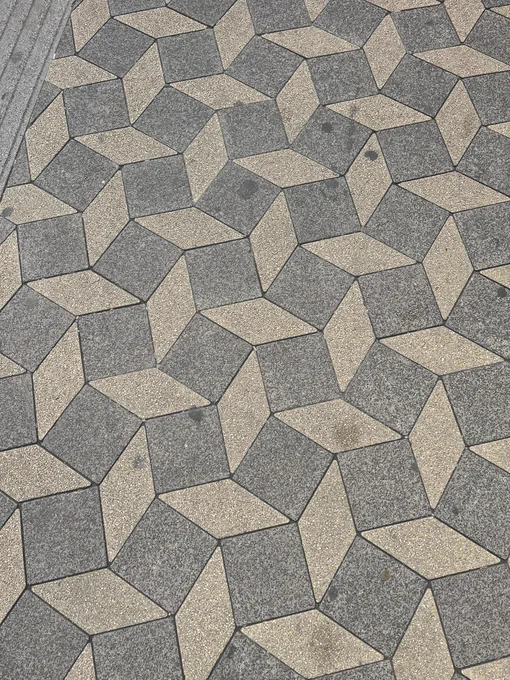 A picture of tessellated diamonds and squares on pavement