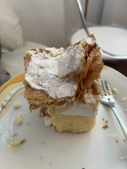 Traditional Slovenian cake. A pastry layer, a custard layer, a sweet cream layer, a pastry layer and then icing sugar.