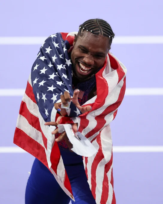 Noah Lyles does the kamehameha from "Dragonball Z" after winning the men's 100m at the Paris Olympics.