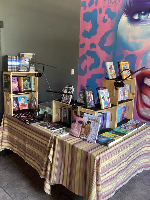 Two tables with queer books displayed