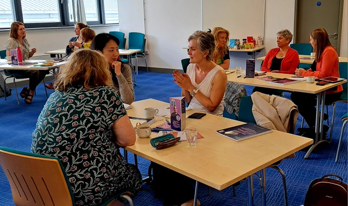 Groups of people in a discussion.
