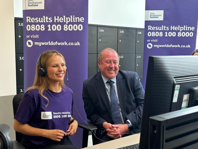 Higher and Further Education Minister Graeme Dey with a member of helpline staff at Skills Development Scotland