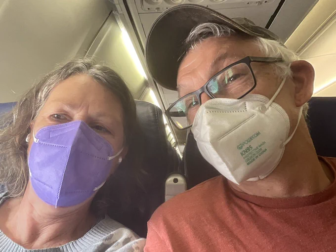 Masking on plane bc of spikes! Kate and Michael on board.
