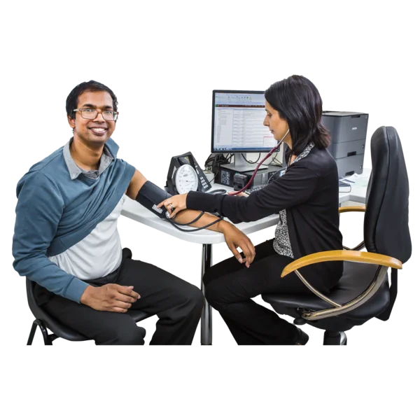 An Asian man has a health check from the Doctor. He is smiling. 