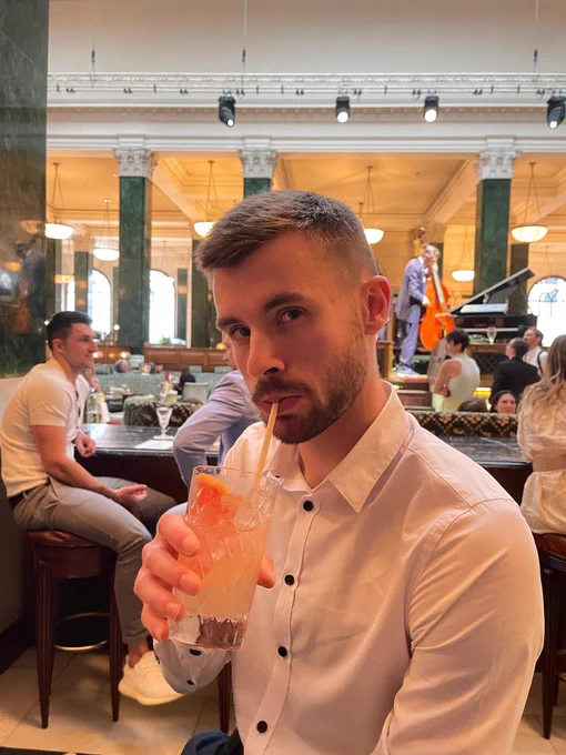 Callum in the Ned Bar, in London, sipping on a cocktail.