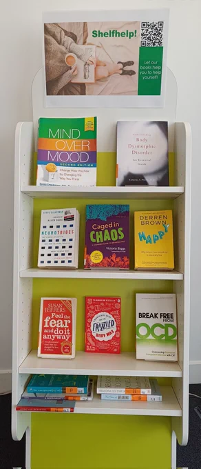 Book display unit of self help books including "Mind Over Matter" and "Happy"