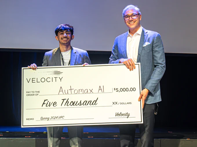 Photo: Automax AI's Humza Ahmed accepts grant from John Dick, director, Velocity Campus