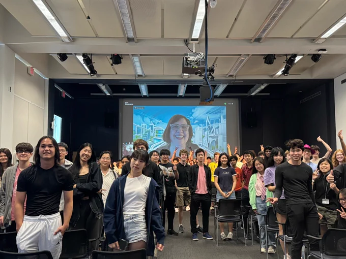 Fiona Cherback of Xbox Game Studios poses virtually for a photo op with students.